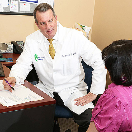 Dr. Dan Bode consulting with a patient